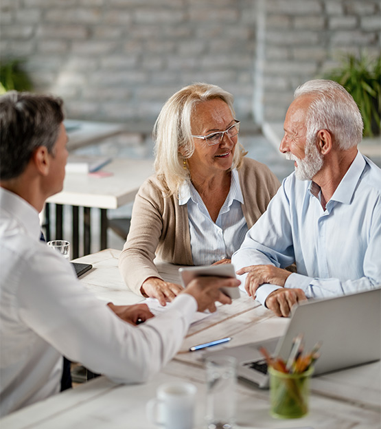 senior couple meeting with financial advisor